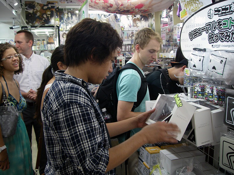 sa2 Japanese collector's items are often impressive with their fine detail and high quality. Here, the students inspect them up close and admire their craftsmanship.